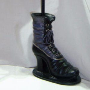 Steel shoe candle holder